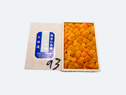 A box of Hokkaido uni (bara) with the uni arranged in a uniform pattern inside the box.